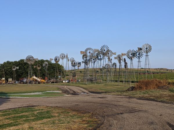 a field full of rusty windmills